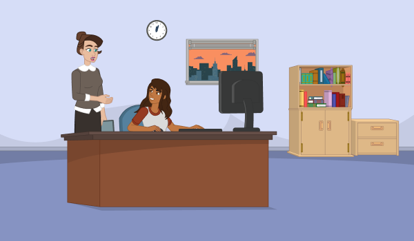 A librarian helps a patron working at a computer.