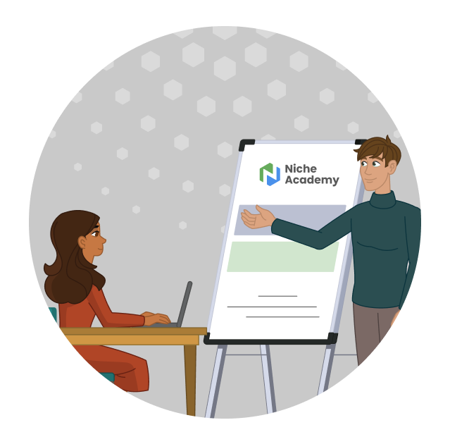 A man stands in front of a whiteboard training a person at a table with a computer. 