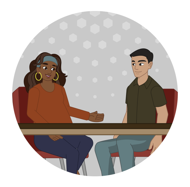 A manager talks with a member of her team. 