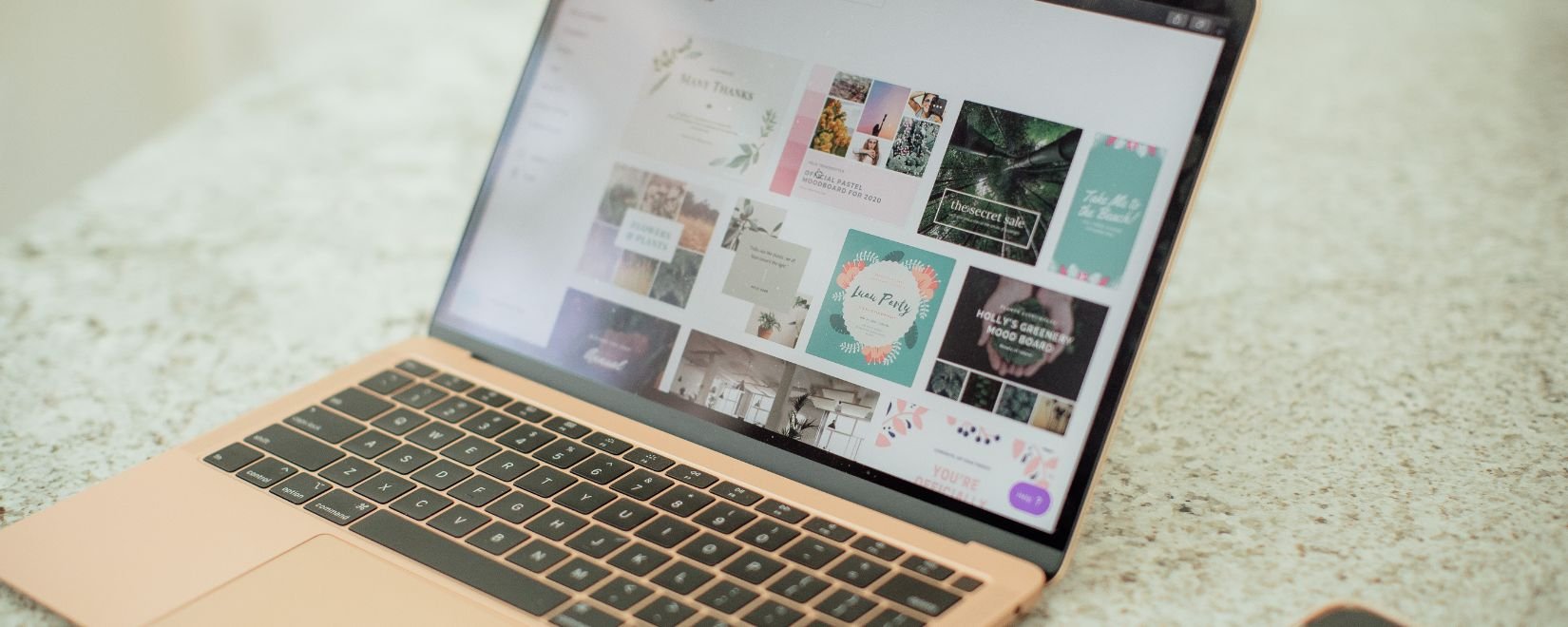 A laptop with the Canva website on screen