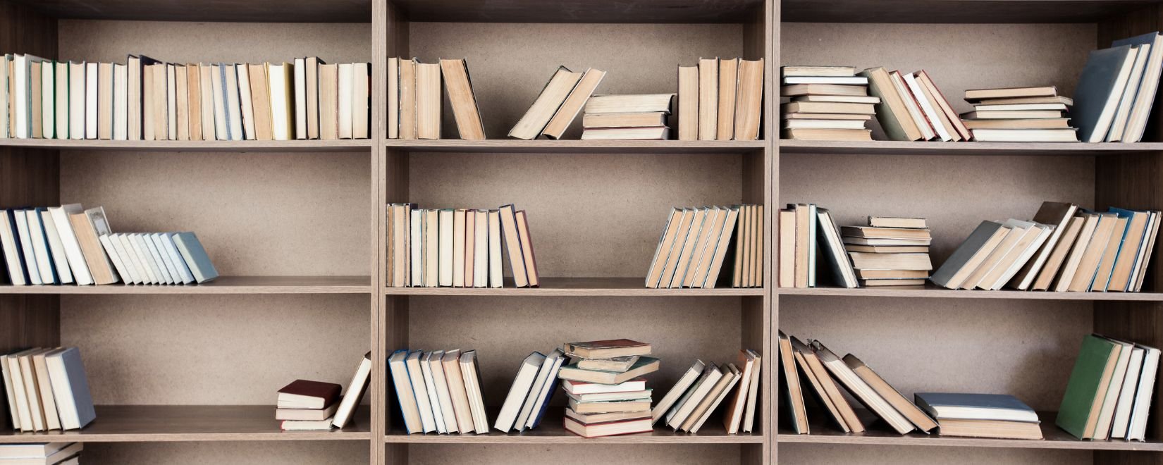 books on shelves with empty spaces
