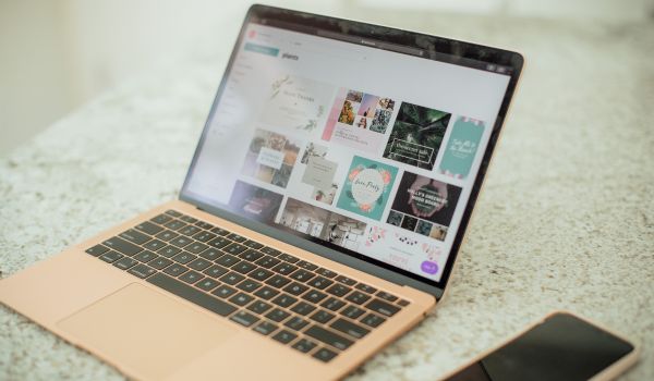 A laptop with the Canva website on screen