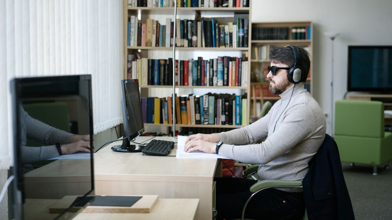 Blind man with a computer